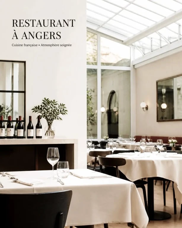 Mets et vin angers : photo éditoriale d’un restaurant français à Angers avec ambiance soignée et verrière lumineuse